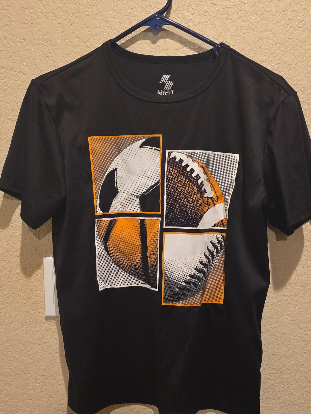 Kids Black Short-Sleeve Graphic Sports Tee with Orange Accents